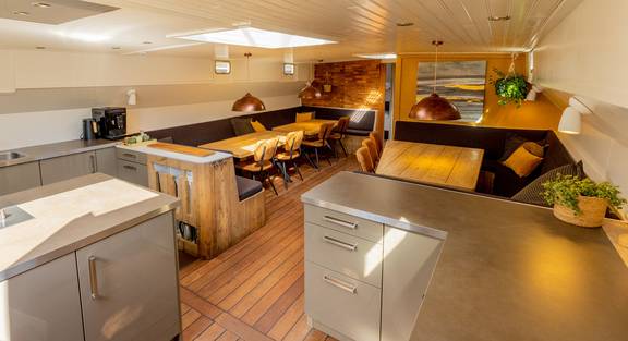 Open kitchen and dining area of the two-masted clipper Avontuur
