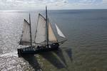 Aerial view of the tjalk Aagtje under full sail