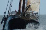 Bow of the tjalk Aagtje moving through the waves