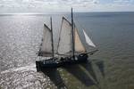 Aerial view of the tjalk Aagtje under full sail