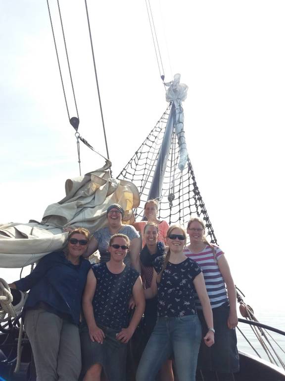 Group of guests on the deck of the tjalk Aagtje