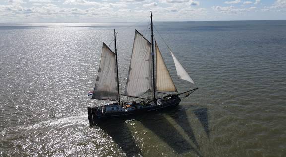 Aerial view of the tjalk Aagtje under full sail