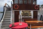 Middle deck of the Abel Tasman with a standing table and stairs