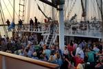 Guests at a party on the deck of the Abel Tasman