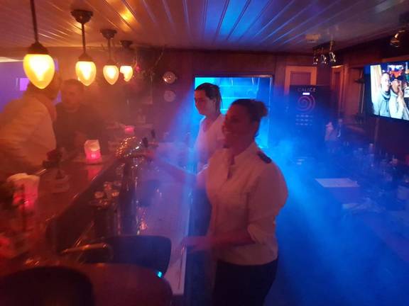 Party with coloured lighting in the bar of the Abel Tasman