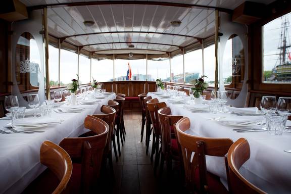 Dinner tables set aboard the saloon boat Adeline