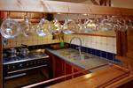 Galley of the Albatros with a cooker and hanging glasses