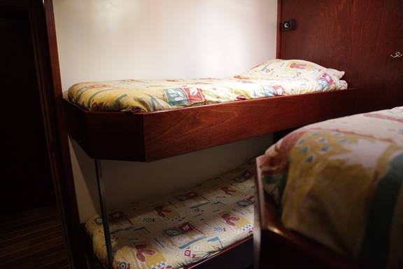Bunk beds with floral bedding on the Aldebaran
