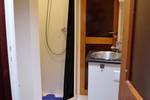Bathroom with a shower and washbasin on the Aldebaran
