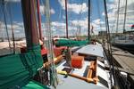View across the deck and seating area of the Allure in harbour
