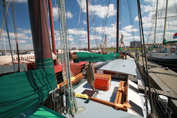 View across the deck and seating area of the Allure in harbour
