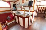 Bar with a beer tap in the saloon of the Allure
