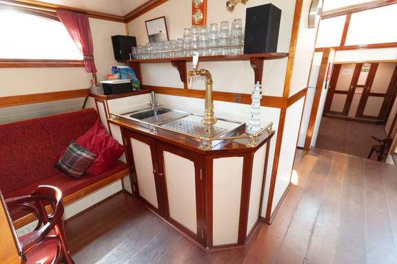 Bar with a beer tap in the saloon of the Allure