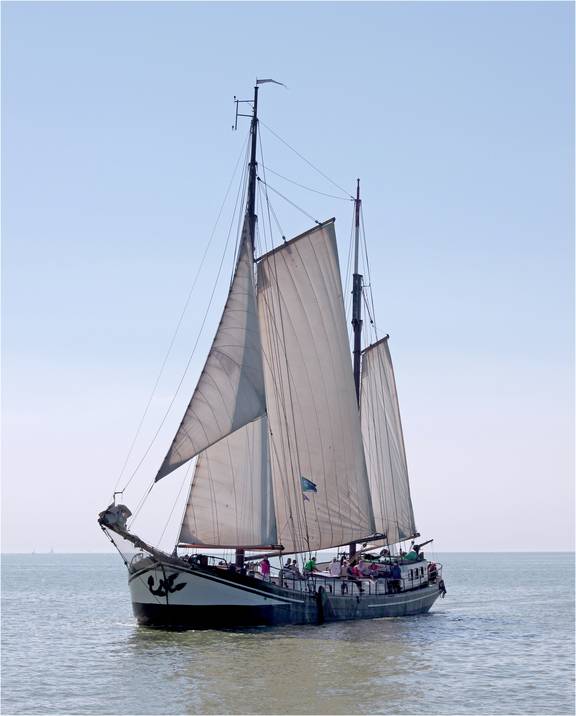 Clipper Allure with sails hoisted on open water