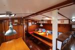 Overview of the wood-panelled saloon of the Anna Trijntje