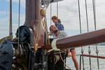 Hoisting the sails on the deck of the clipper Anna