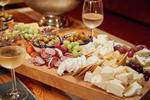 Cheeses and snacks on a sharing platter aboard the Anna