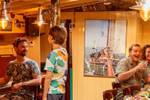 Guests in the saloon with a bar aboard the Anna
