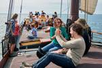 Guests sitting together on the deck of the clipper Anna