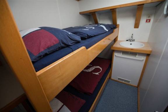 Cabin with a bunk bed and washbasin on the Avanti