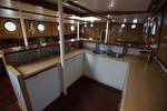 Galley with white kitchen units and wooden trim on the Avanti