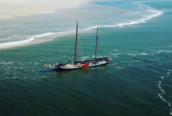 Aerial view of the Avontuur near the sandbanks of Terschelling