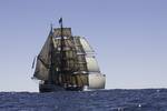 Barque Europa under full sail at sea, viewed from behind