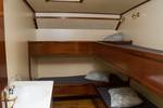 Four-berth cabin with bunk beds and a washbasin on the Summertime