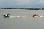 RIB of the Summertime towing guests on an inflatable ring across the water