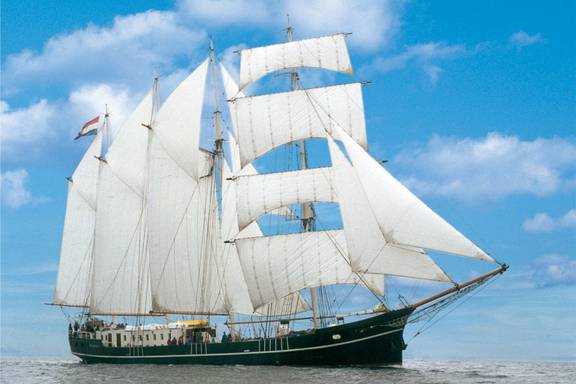 Barquentine Summertime with white sails hoisted