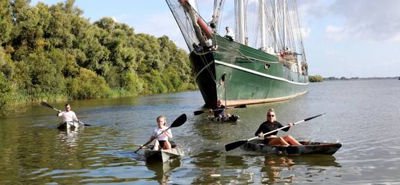 Guests canoeing beside the Summertime