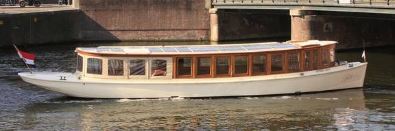 Saloon boat Belle van Zuylen viewed from the side on the water