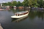Saloon boat Belle van Zuylen cruising along an Amsterdam canal