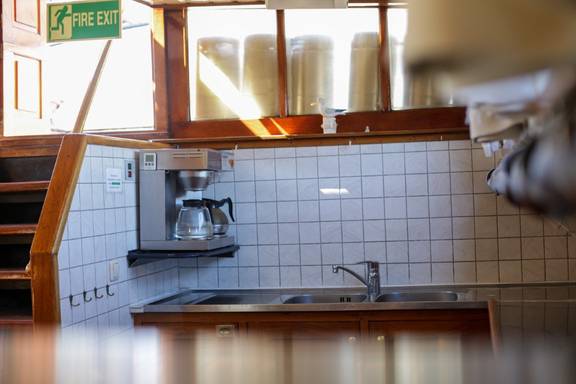 Sink and wooden worktop in the galley of the Boekanier