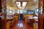 Saloon of the Boekanier with wooden tables and chairs