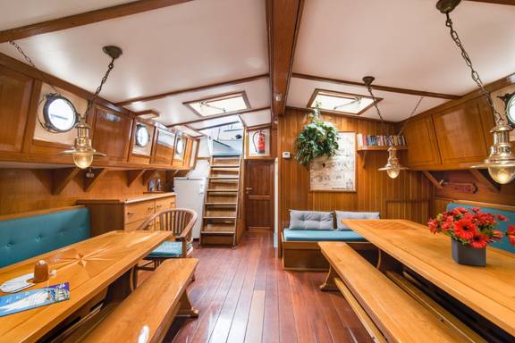 Saloon of the Bonnefooi with wooden tables and skylights