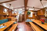 Saloon of the Bonnefooi with wooden tables and skylights