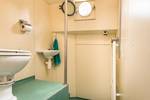 Shower and washbasin aboard the Bonnefooi