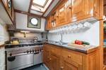 Wooden galley with a cooker and worktop on the Bonnefooi