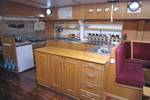 Wooden galley with a cooker and worktop on the Broedertrouw