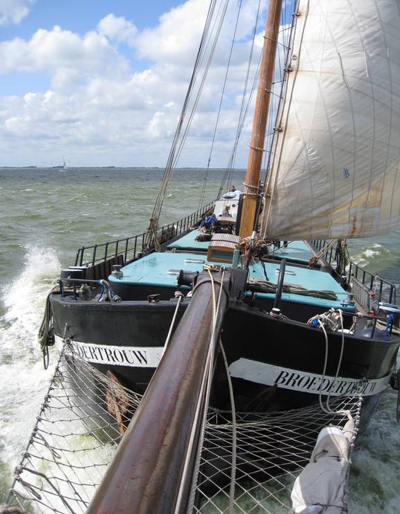 View from the bowsprit towards the Broedertrouw under sail