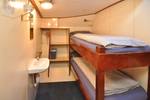 Cabin with a bunk bed and washbasin on the Chateauroux