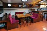 Seating area with a wooden table and red benches in the Chateauroux