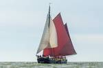 Chateauroux under white and brown sails on open water