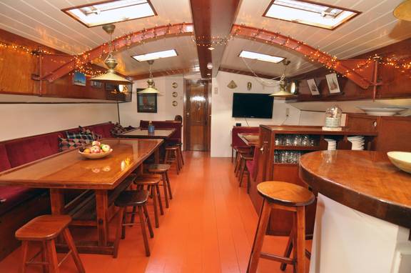 Saloon of the Chateauroux with wooden dining tables and benches