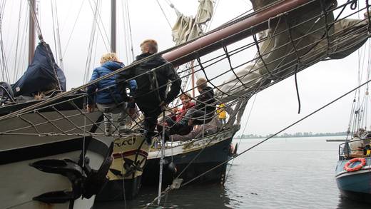 Guests boarding a sailing ship via the gangway