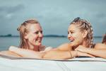 Two guests relaxing in the hot tub on De Hester