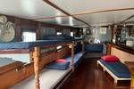 Bunk beds and a separate bed in the former wheelhouse of the Vrijheid