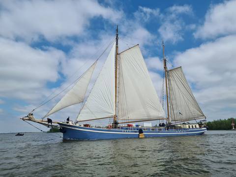 Two-masted clipper De Hester with white sails hoisted