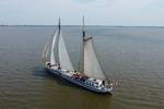 Aerial view of De Hester sailing on open water